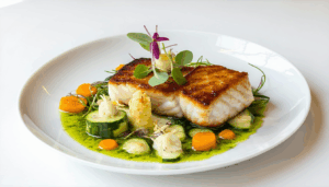 Plonger au cœur des traditions culinaires, c’est souvent s’immerger dans un monde où le passé et le présent se rencontrent. Les ailes de raie, malgré leur simplicité apparente, sont un exemple parfait de ce mariage des saveurs d’hier et d’aujourd’hui. […]